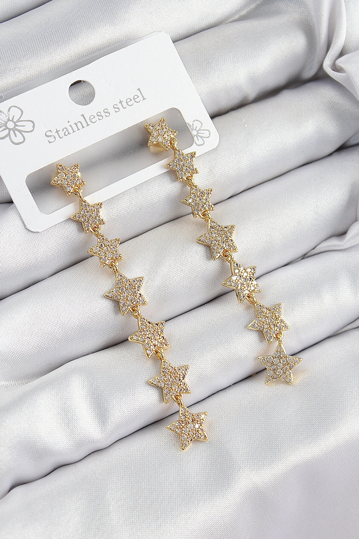 Clariss Pirinç Zirkon Taşlı Sallantılı Yıldız Model Gold Renk Kadın Küpe