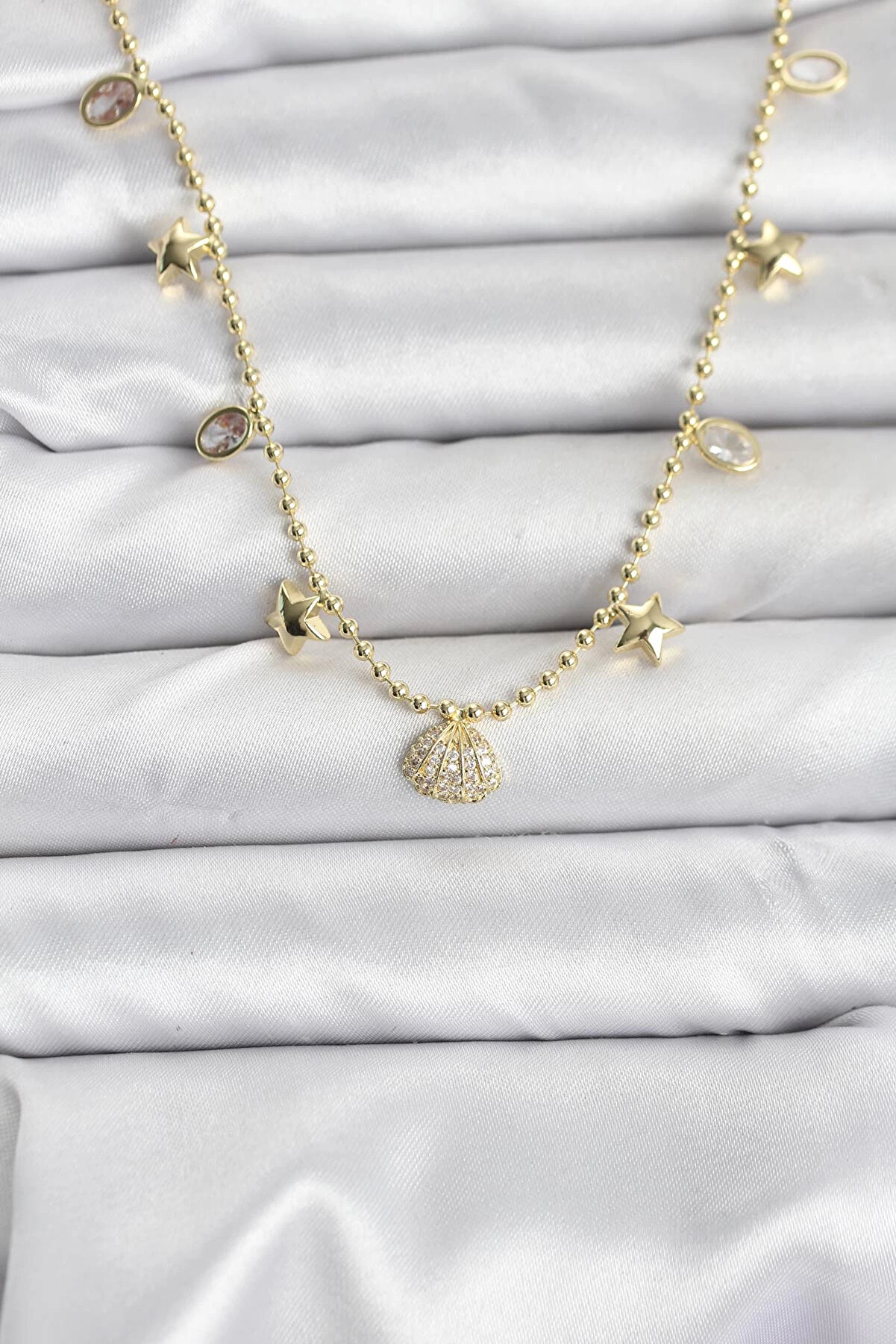 Clari̇ss Pi̇ri̇n&ccedil; Gold Renk Zi̇rkon Taşlı Deni̇z Kabuğu Model Kadın Kolye