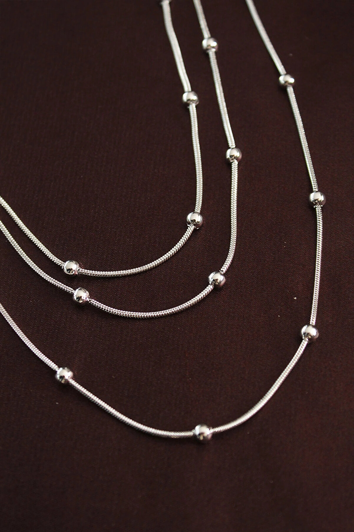 Kyops Harmonyaura 316L &Ccedil;eli̇k G&uuml;m&uuml;ş Renk Mi̇ni̇mal Top&ccedil;uk Model &Ccedil;oklu Kolye