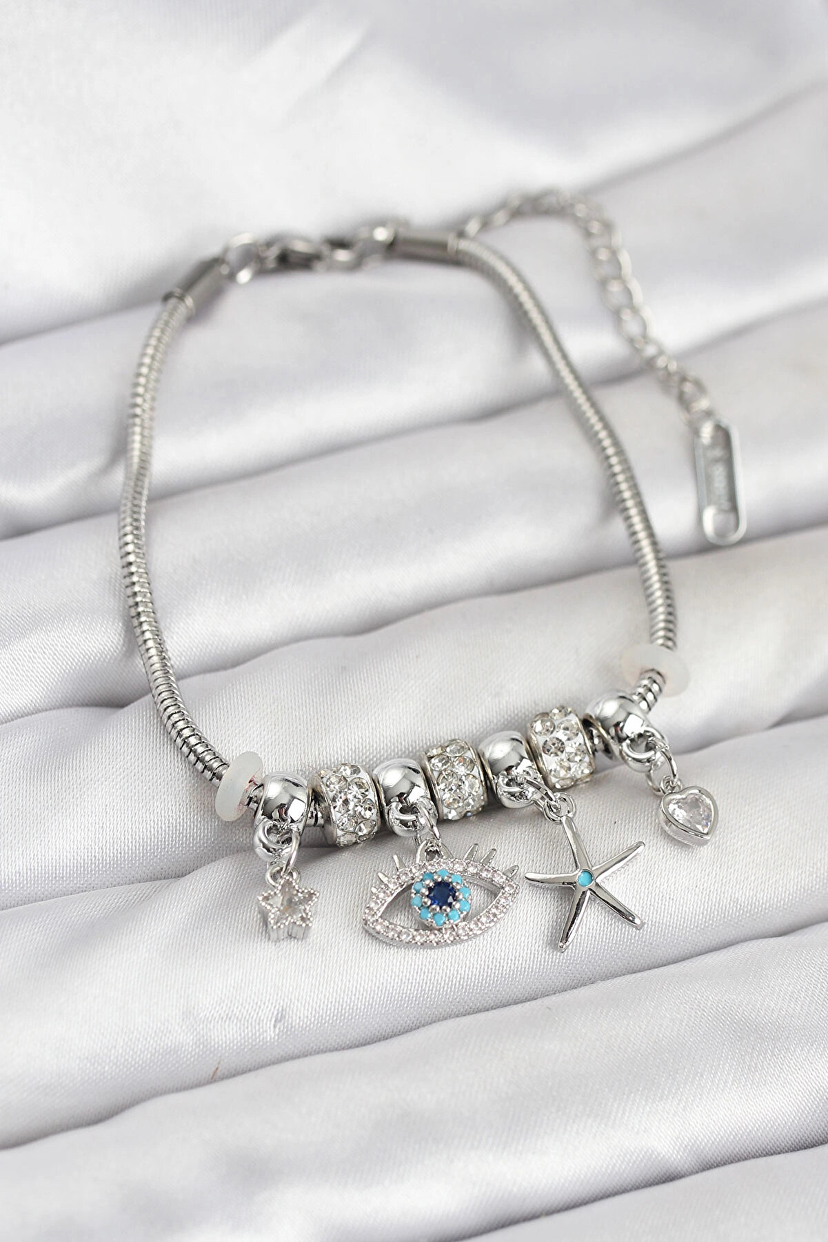 Buti̇k Pi̇ri̇n&ccedil; G&uuml;m&uuml;ş Renk G&ouml;z Model Charmlı Kadın Bi̇lekli̇k